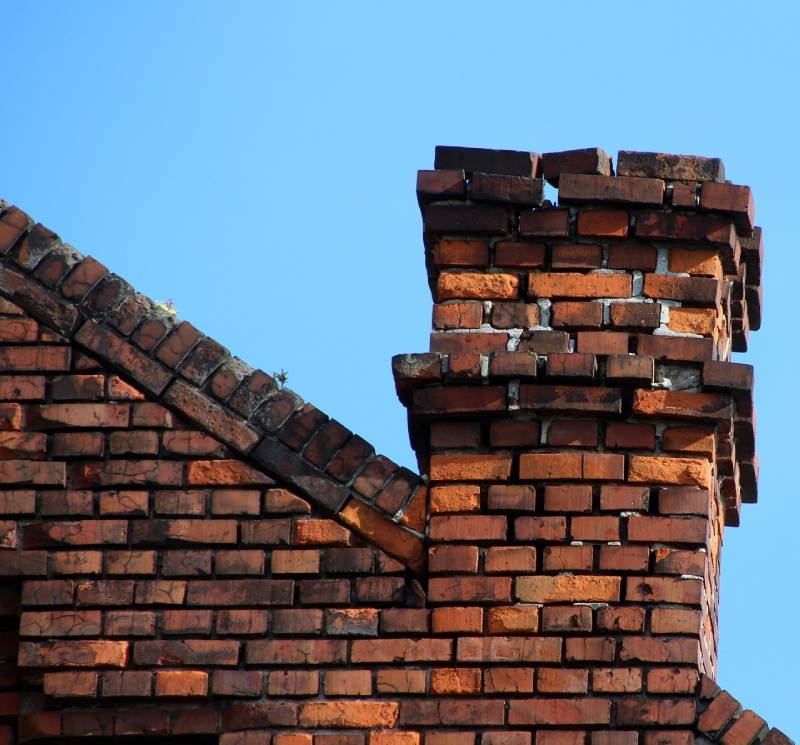 Signs Your Blue Island Home Needs a Chimney Inspection Damaged chimney on an Blue Island home showing cracks and missing mortar